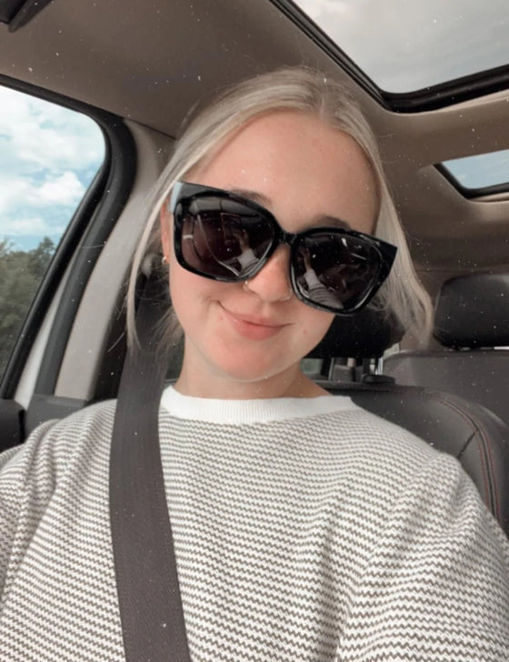 Grace S. wearing fit-over sunglasses